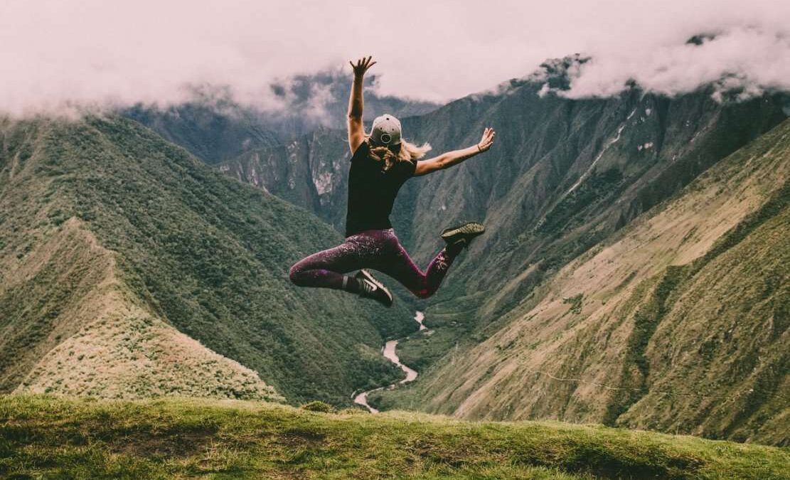 A person jumping high in spirit, symbolizing the exhilaration and freedom of overcoming anxiety on the path to personal growth